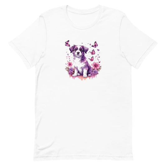 White crew neck short sleeved t-shirt, feature a tapestry of colors and a joyful cute puppy nestle in butterflies and floral garden.