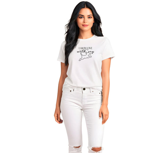White crew neck short sleeved t-shirt, feature a dog jumping, above the message "i am in love with my dog" in bold black graphic style. Female model shown in close-up to highlight print and fit.