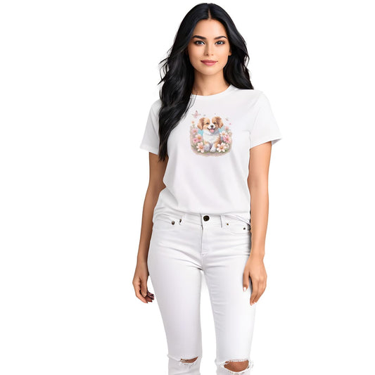 White crew neck short sleeved t-shirt, feature an adorable Spaniel pup frolics amidst a bouquet of blossoms in a charming wicker basket. Female model shown in close-up to highlight print and fit.