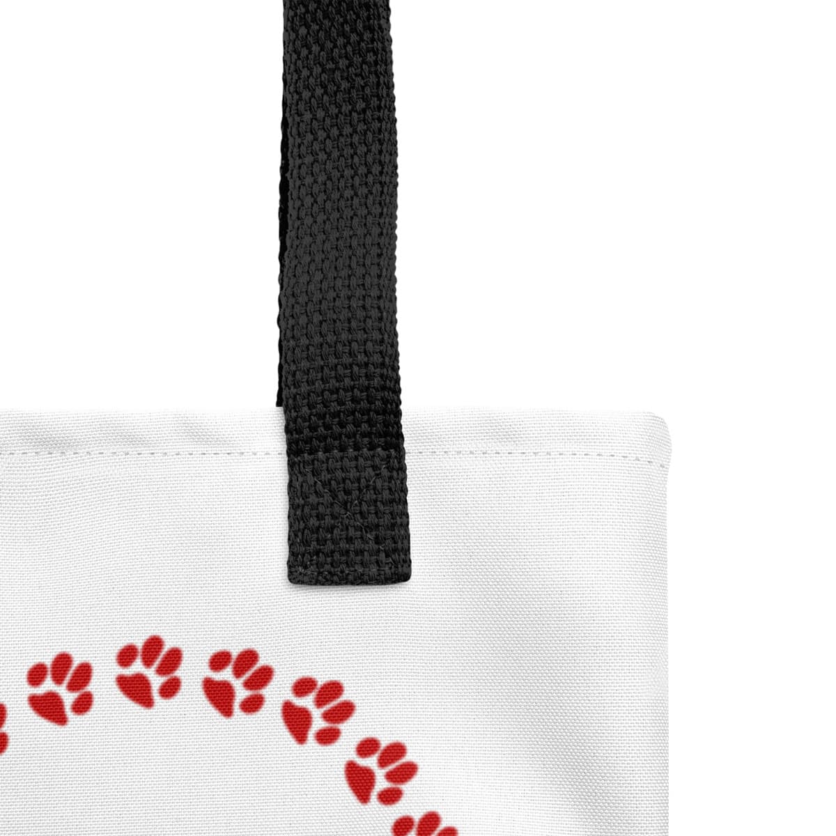 Close up of seams and stitch of a Uni-size 15"x15" white tote polyester canvas bag, with black stripped handle, feature a black one-line large paw print, underlay by bold LOVE with a cute silhouette dog in the ”o” in red color.