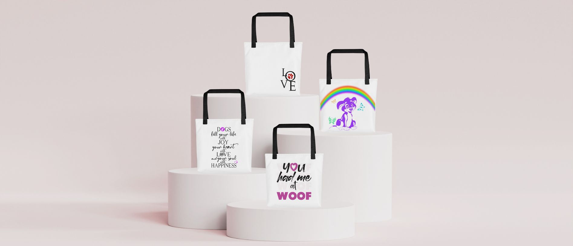 Set of white tote bags with dog themed printed designs on a light pink background