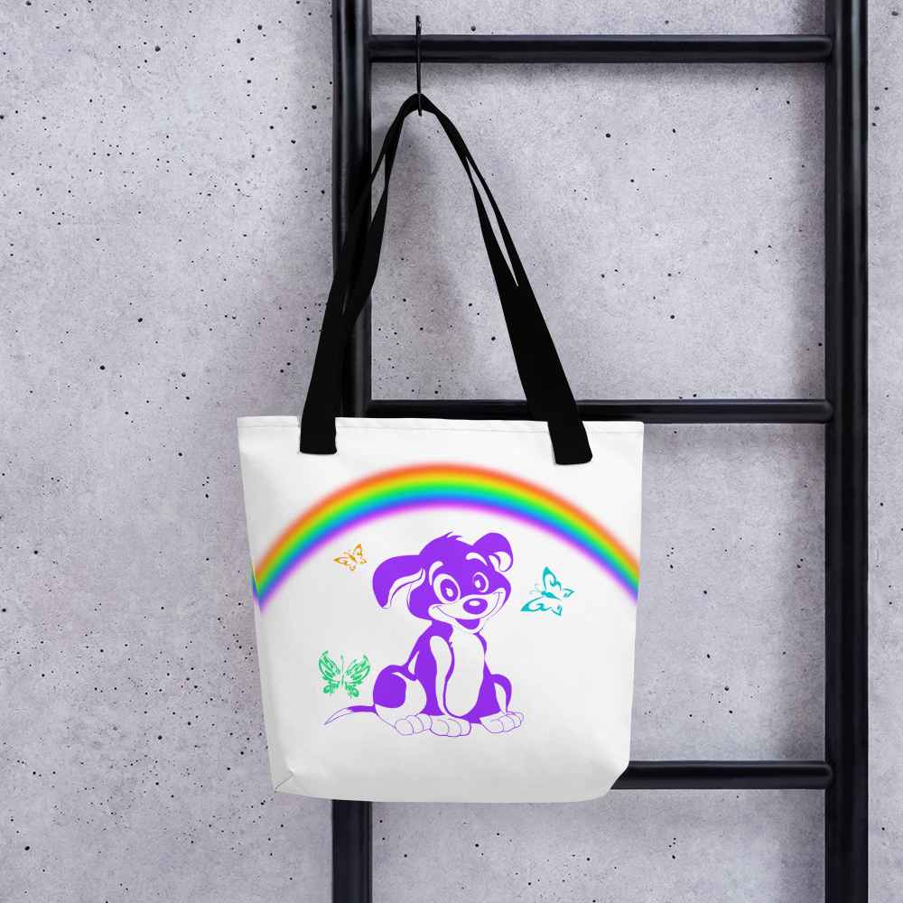Hanging on a hook a White spun canvas fabric tote bag, with black handle stripped, on the tote is a cute graphic cartoonist puppy dog sitting with a happy face, surrounded by colorful sizes butterflies, above is a colorful rainbow "