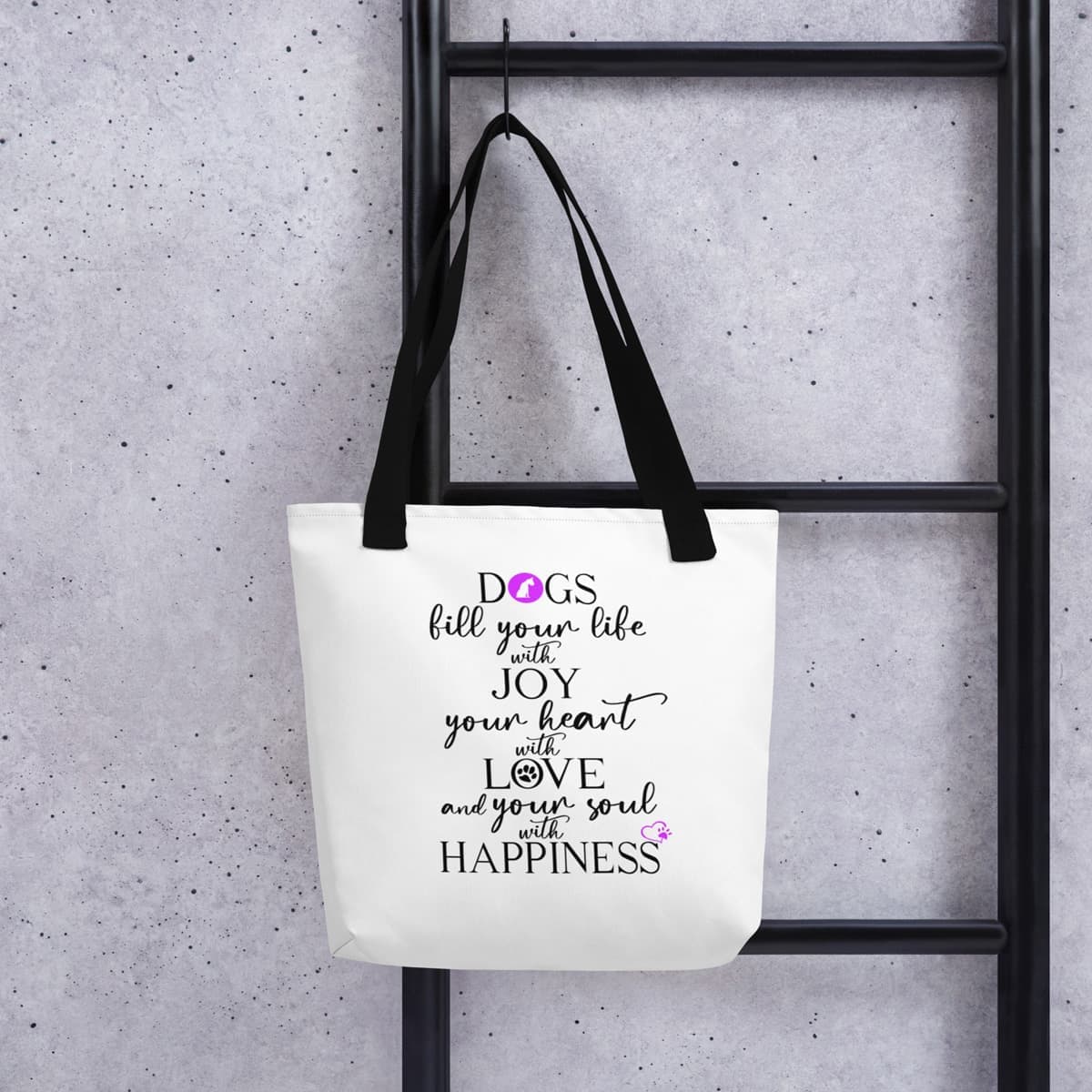White spun canvas fabric tote bag, with black handle stripped, on the tote is graphic quote saying" dogs fill your life with joy, your heart with love and your soul with happiness"
