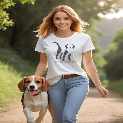 Women walking on the country gravel track, with a beagle. She is wearing a White crew neck short sleeved t-shirt, featuring an adorable Beagle hand drawn silhouette graphic print with the text "I am so adorable." underneath the dog.