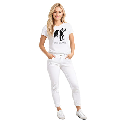 White crew neck short sleeved t-shirt, featuring a hand-drawn black and white one-line graphic print silhouette of an adorable Bernese Mountain with its tongue out. The text "I am so adorable" underneath the dog . Female model shown in close-up to highlight print and fit.