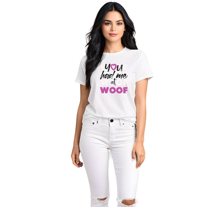 White crew neck short sleeve t-shirt featuring the classic quote 'You Had Me at WOOF' across the chest. Female model close-up highlights print and relaxed fit, soft cotton tee for dog lovers.