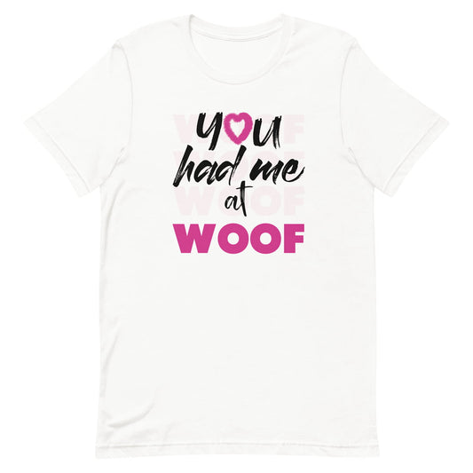White crew neck short sleeved t-shirt, feature a graphic classic quote ”you had me at woof”  across chest. 