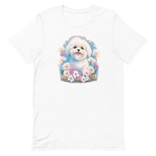
White crew neck short sleeve t-shirt with a colorful hand-drawn Coton de tulear puppy graphic sitting in a floral garden.