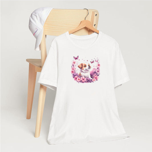 White crew neck short sleeved t-shirt, feature an intricate colorful hand-drawn lively puppy amidst a blooming wicker floral and butterfly basket garden.