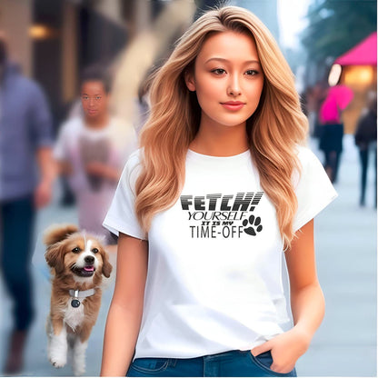 Women walking at pedestrian street, followed by dog tailing. She is wearing a White crew neck short sleeved t-shirt, feature a fun statement, quote Fetch yourself it is my time-off. 