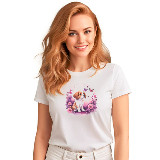 White crew neck short sleeved t-shirt, feature a playful pup amidst a whimsical floral fiesta.  Female model shown in close-up to highlight print and fit.