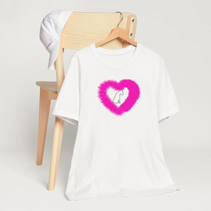 White crew neck short sleeved t-shirt, feature a sitting black one-lined hand drawn dog, in a fluffy pink heart.T-shirt hanging on chair shown in close-up to highlight print and size.