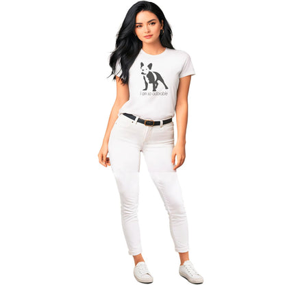 White crew neck short sleeved t-shirt, featuring a one-line graphic print of a hand-drawn French Bulldog with its tongue out, and the playful text "I am so adorable”. Female model shown in close-up to highlight print and fit.