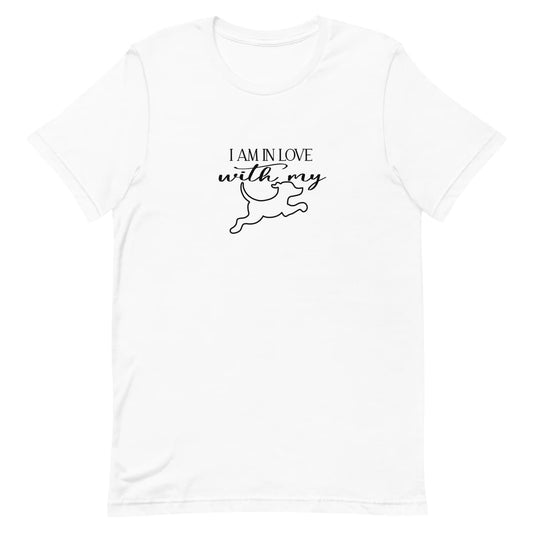 White crew neck short sleeved t-shirt, feature a dog jumping, above the message "i am in love with my dog" in bold black graphic style.