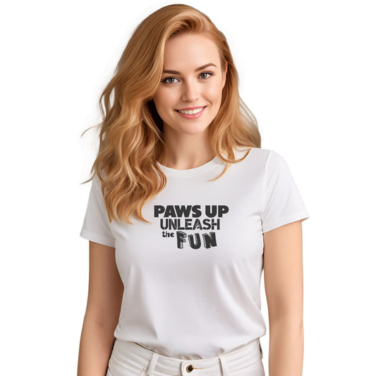 White crew neck short sleeved t-shirt, featuring a playful "paws up unleash the fun" black graphic. Female model shown in close-up to highlight print and fit.