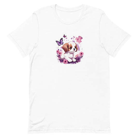 White crew neck short sleeved t-shirt, feature an irresistible, adorable puppy lounging amidst a flourishing tapestry of blossoms and butterflies, in a rustic wicker basket.