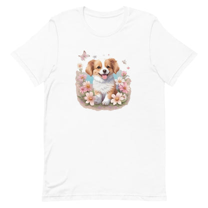 White crew neck short sleeved t-shirt, feature an adorable Spaniel pup frolics amidst a bouquet of blossoms in a charming wicker basket. 