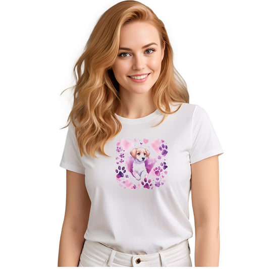 White crew neck short sleeved t-shirt, Feature a vibrant colorful design of a lively, adorable puppy surrounded by a whirlwind of paws and hearts. Female model shown in close-up to highlight print and fit.