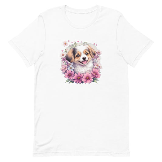 White crew neck short sleeved t-shirt, stars a cheeky Aussie Shepherd pup amidst a whimsical wicker-basket garden.