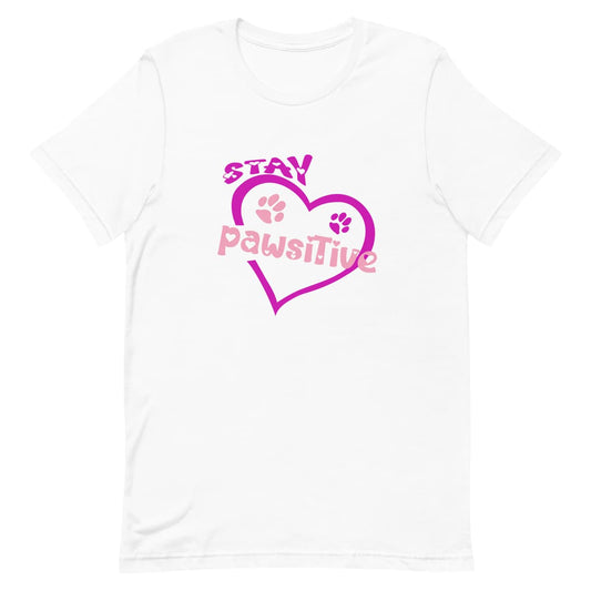 White crew neck short sleeved t-shirt, featuring pink and purple paws nestle in a pink heart and a fun message ”stay paw-sitive” with doggo twist in bold vibrant colorful graphic style. 