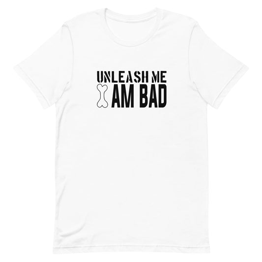 White crew neck short sleeved t-shirt, features a playful humor with a twist, reading the bold black graphic text ”unleash me i am bad” wording I, illustrate a dog bone on its point.