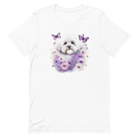 White cotton crew neck unisex short sleeve tshirt, on the apparel is a detailed kawaii illustration print of a lively cute adorable coton de tulear surrounded by floral arrangement in a wicker basket. The design brings a touch of color, warmth, and charm in pastel color palette to the shirt print.