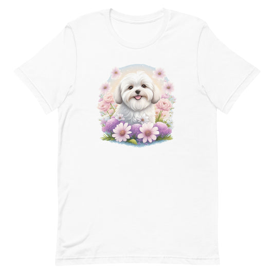 White cotton crew neck unisex short sleeve tshirt, on the apparel is a detailed kawaii illustration print of a lively cute adorable coton de tulear surrounded by floral arrangement in a wicker basket. The design brings a touch of color, warmth, and charm in pastel color palette to the shirt print.