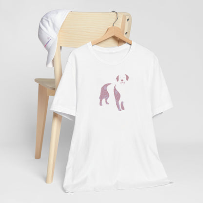 White crew neck short sleeved t-shirt, feature a Golden Retriever silhouette with floral and swirl pattern design in vibrant colors.T-shirt hanging on chair shown in close-up to highlight print and size.