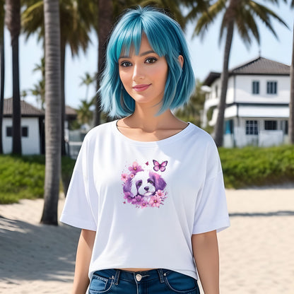 Women standing on a beach, wearing a white crew neck short sleeved t-shirt, feature a cute Maltese puppy face, in nestle butterflies and floral garden. 