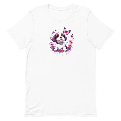 White crew neck short sleeved t-shirt, featuring an adorable puppy nestled amidst a wicker basket overflowing with vibrant blooms and fluttering butterflies.