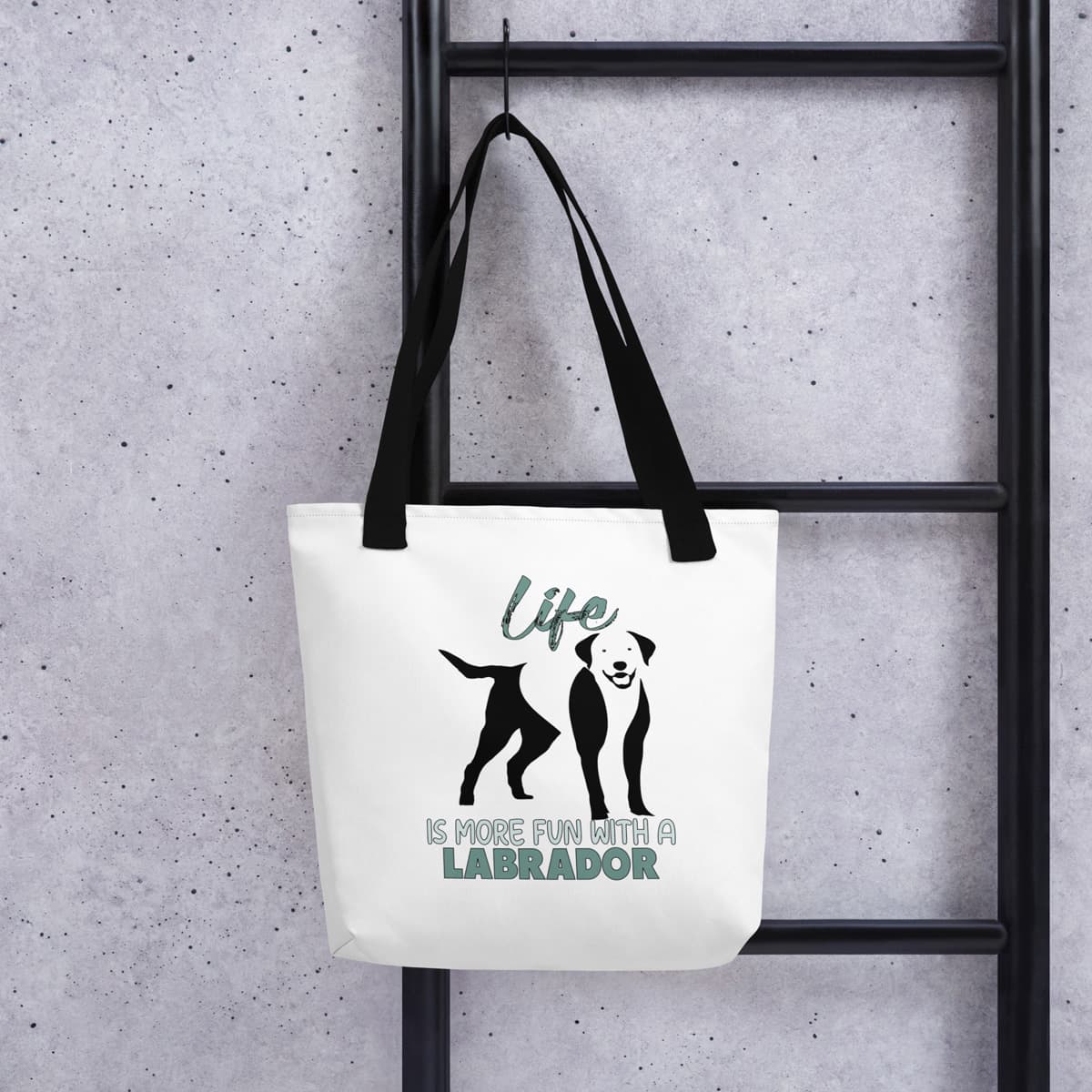 Hanging on a hook, Uni-size 15"x15" white tote polyester canvas bag, with black stripped handle, feature a black one-line Labrador print with life quote ”life is more fun with a Labrador”. Printed front and back.
