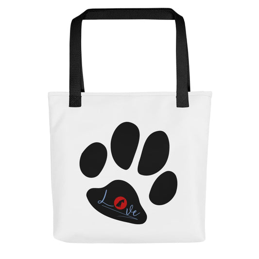 Front of a Uni-size 15"x15" white tote polyester canvas bag, with black stripped handle, feature a black one-line large paw print, underlay by bold LOVE with a cute silhouette dog in the ”o” in red color. 