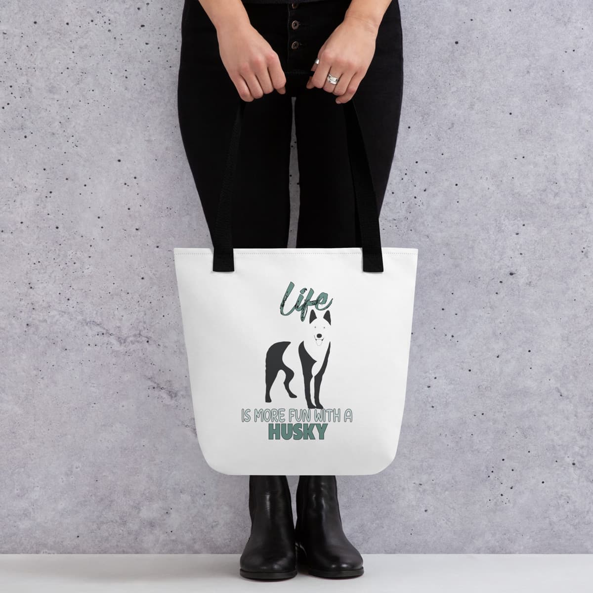 Uni-size 15"x15" white tote polyester canvas bag, with black stripped handle, feature a black one-line Siberian Husky print with life quote ”life is more fun with a husky”. Printed front and back.