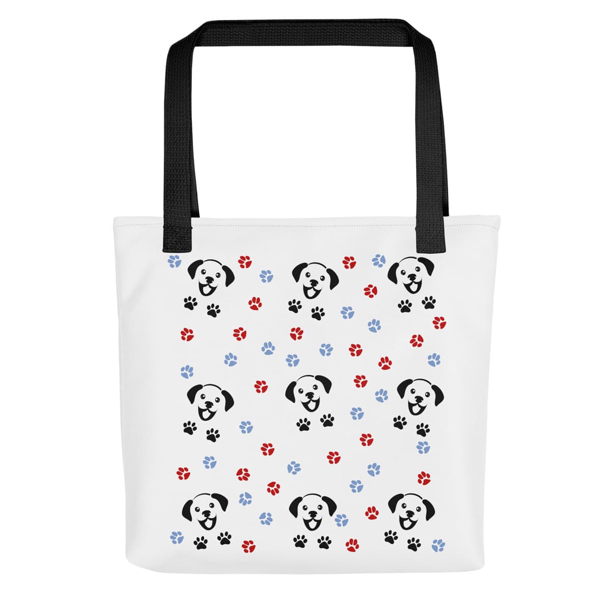 White spun canvas fabric tote bag, with black handle stripped, on the tote is a cute graphic cartoonist happy puppy face, surrounded by colorful paws.