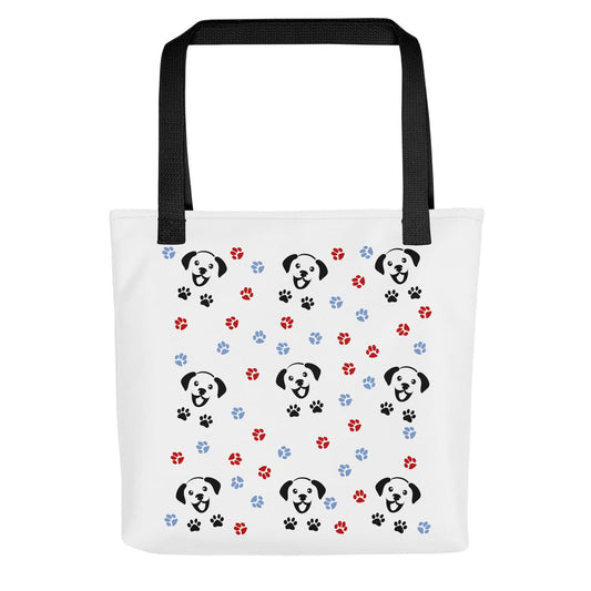 White spun canvas fabric tote bag, with black handle stripped, on the tote is a cute graphic cartoonist happy puppy face, surrounded by colorful paws.
