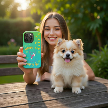 Woman holding a phone with a 'Happy Day' case next to a small dog outdoors.
