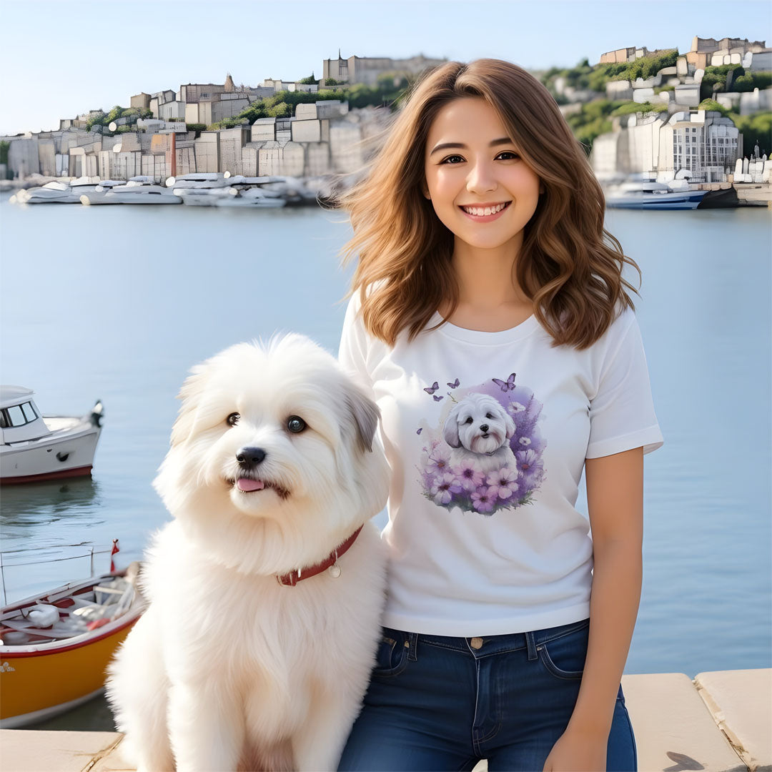 4 White cotton crew neck unisex short sleeve tshirt, on the apparel is a detailed kawaii illustration print of a lively cute adorable coton de tulear surrounded by floral arrangement in a wicker basket. The design brings a touch of color, warmth, and charm in pastel color palette to the shirt print.