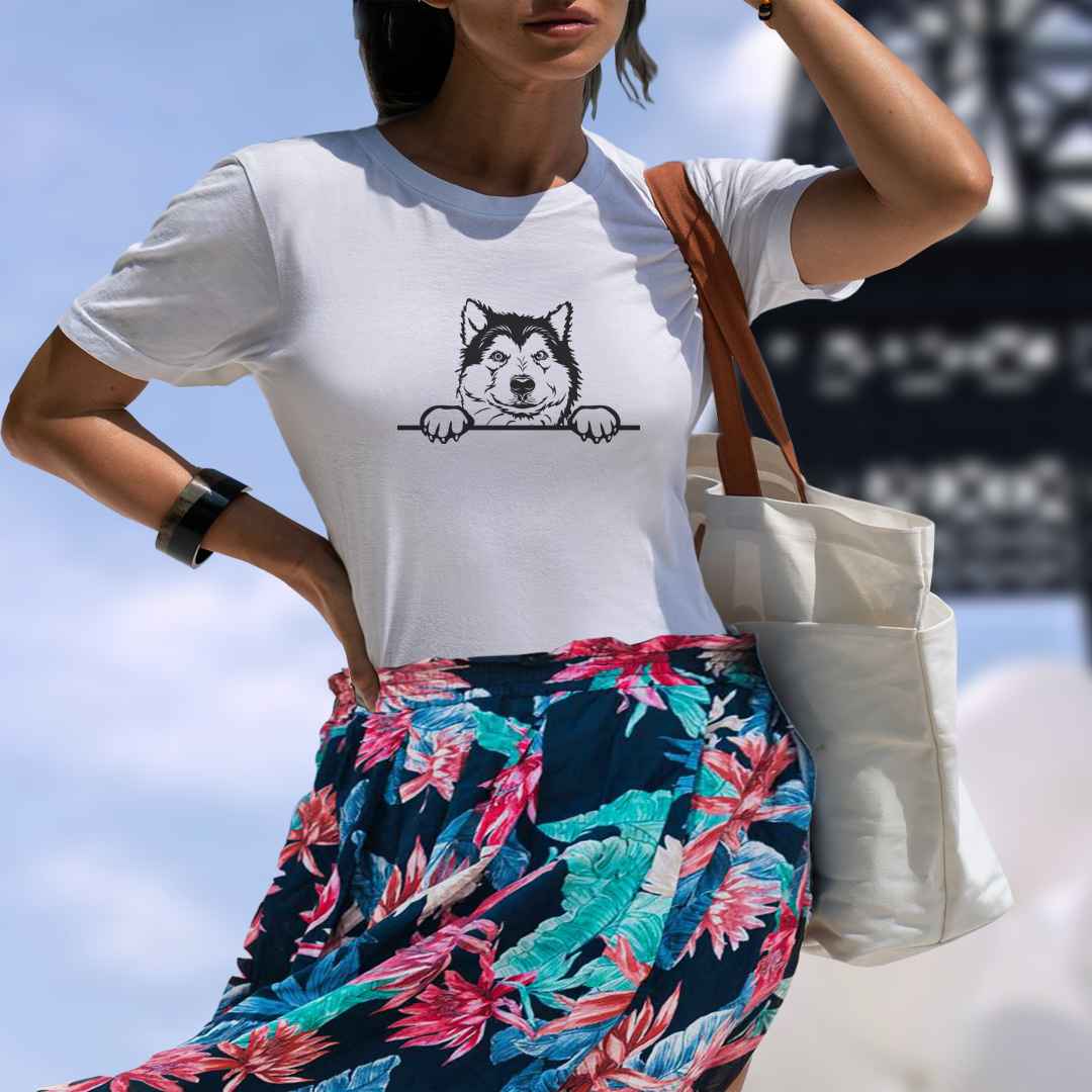 White cotton crew neck unisex  short sleeve tshirt, on the apparel is a black/white one-line  graphic of a cute alaskan malamute dog face,  putting it´s paws on the table. 