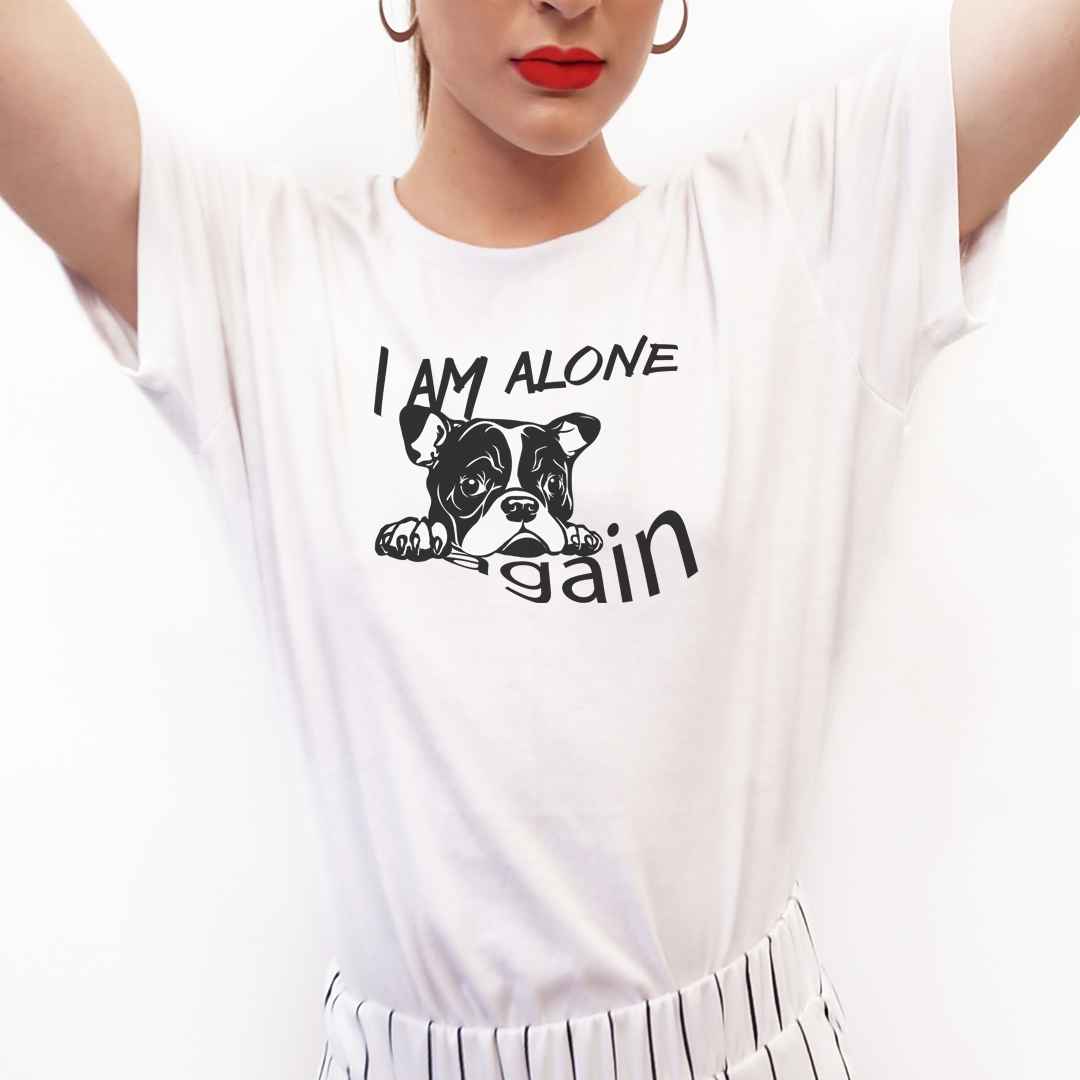 White cotton crew neck unisex  short sleeve tshirt, on the apparel is a black /white graphic bulldog face of a pop sopping looking sad, above the dog is the text "I am alone" below the dog is the text "again".