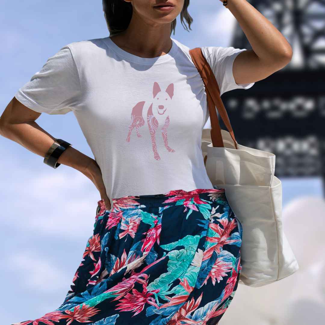 White cotton crew neck unisex  short sleeve tshirt, on the apparel is a graphic print silhouette of a cute shepherd standing with its tongue out the silhouette is with flowers and patterns in colors pink and purple reminds a bit of flower power