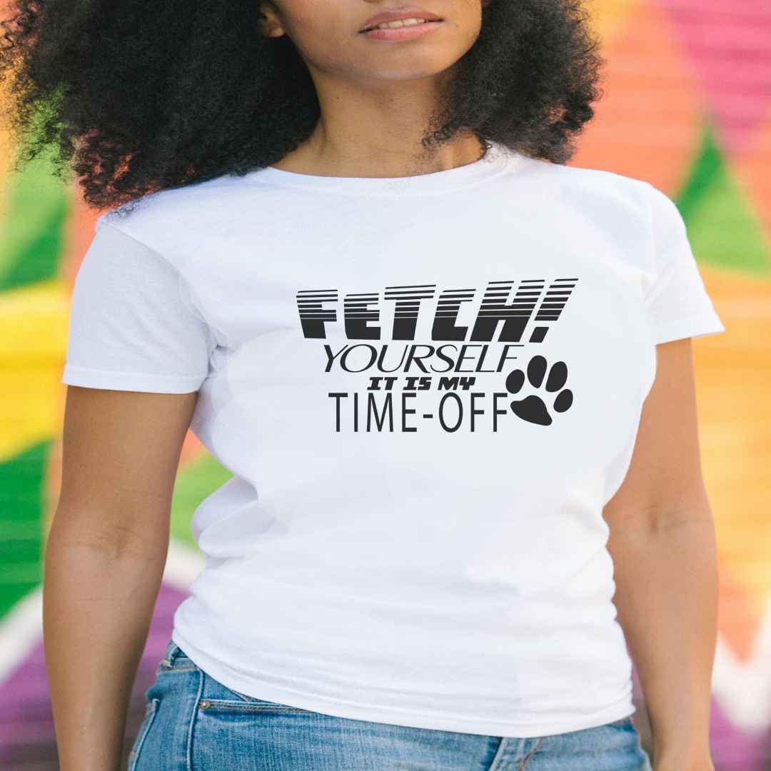 White cotton crew neck unisex short sleeve tshirt, on the apparel is a graphic black text saying "fetch yourself it is my time-off"  at the end of the text is a paw in black graphic.