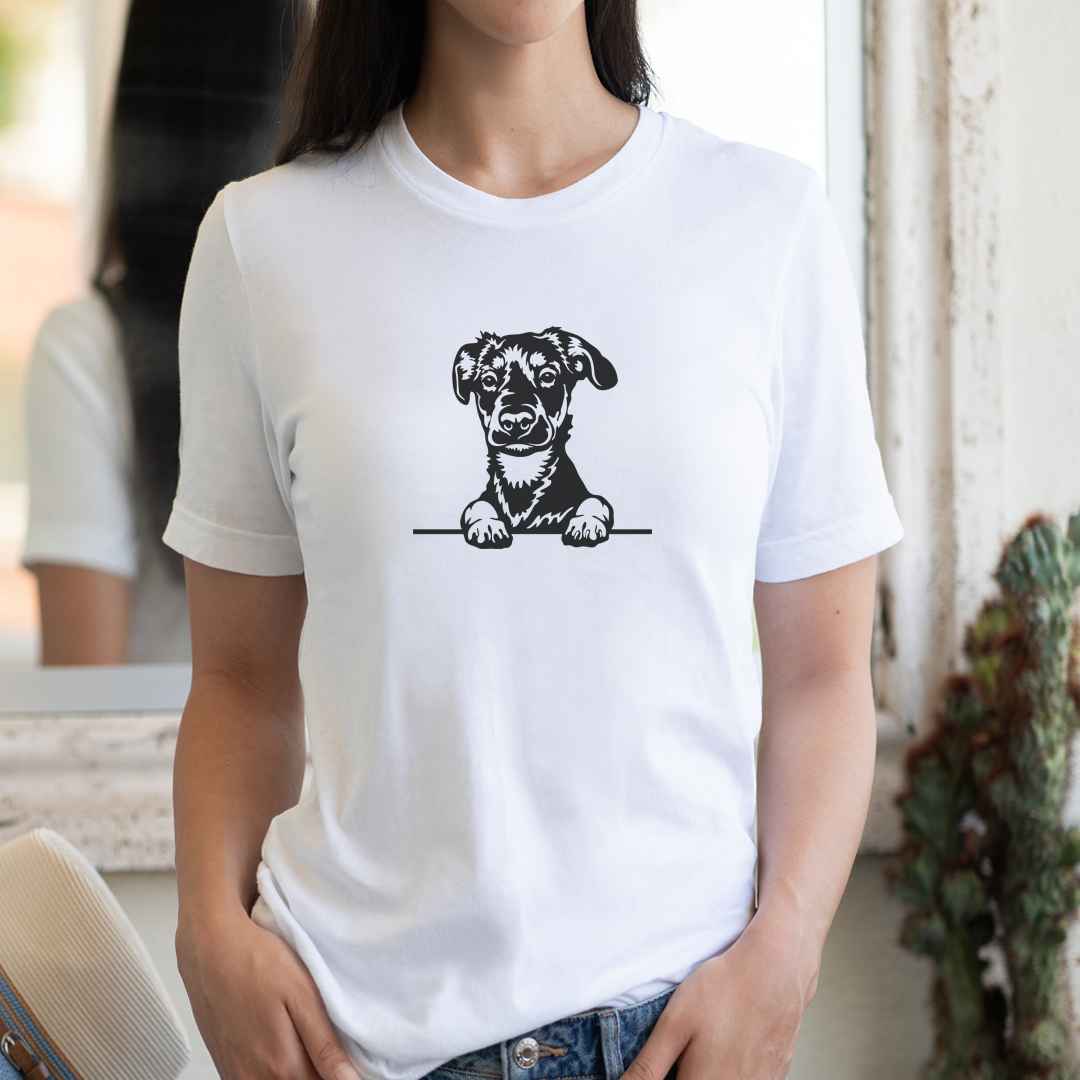 White cotton crew neck unisex  short sleeve tshirt, on the apparel is a black/white one-line  graphic of a cute Rottweiler puppy dog face,  putting it´s paws on the table.