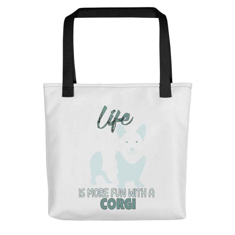 White spun canvas fabric tote bag , on the bag is a black one-line graphic print silhouette of a cute Welsh Corgi dog standing with its tongue out. Above the dog is the text " LIFE" in cap and underneath the dog is the text " is more fun with a Corgi " in cap" 