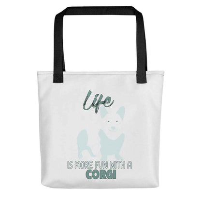 White spun canvas fabric tote bag , on the bag is a black one-line graphic print silhouette of a cute Welsh Corgi dog standing with its tongue out. Above the dog is the text " LIFE" in cap and underneath the dog is the text " is more fun with a Corgi " in cap" 