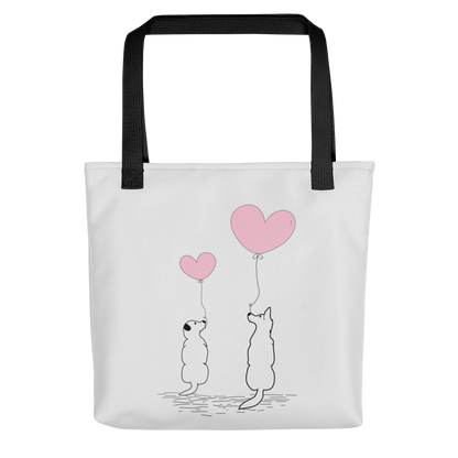 White spun canvas fabric tote bag, with black handle stripped, on the tote is two graphic dogs sitting beside each other. facing each other, with each a pink ballon, holding it string, the theme for this tote is "love is in the air"