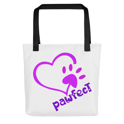 White spun canvas fabric tote bag, with black handle stripped, on the tote is  cute graphic pink shaped heart with a paw on the side, underneath the heart is the tilted text "pawfect"  in color purple