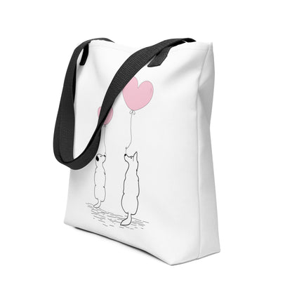 White spun canvas fabric tote bag, with black handle stripped, on the tote is two graphic dogs sitting beside each other. facing each other, with each a pink ballon, holding it string, the theme for this tote is "love is in the air"