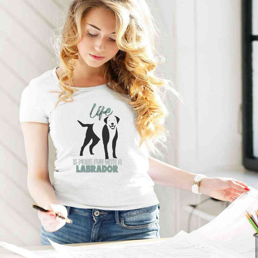 Women wearing a white short sleeve, crew neck t-shirt, featuring a black silhouette of a cute Labrador, with a message "life is more fun with a Labrador. 