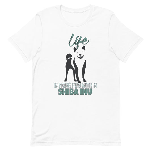 White cotton crew neck unisex  short sleeve tshirt, on the apparel is a black one-line graphic print silhouette of a cute Shiba Inu standing with its tongue out. Above the dog is the text " LIFE" in cap and underneath the dog is the text " is more fun with a Shiba Inu" in cap"