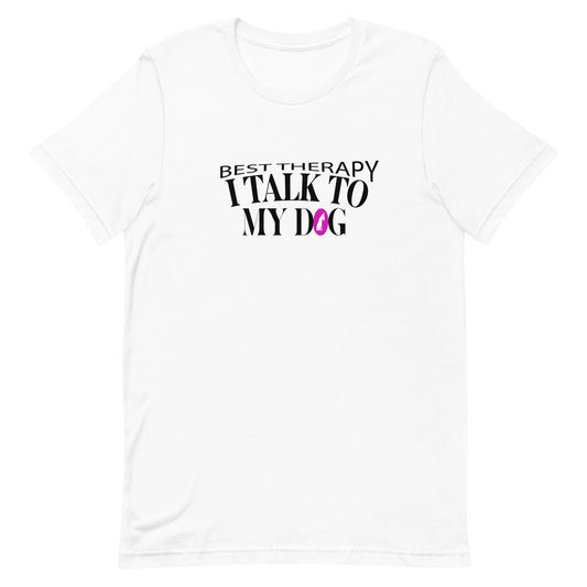 White cotton crew neck unisex  short sleeve tshirt, on the apparel is a graphic black/white text  saying "best therapy i talk to my dog"  the letter O in "dog" is a pink dog sitting